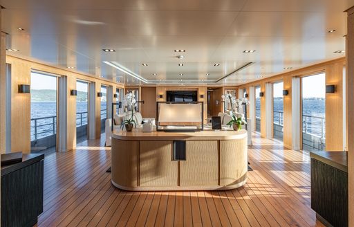 Charter yacht REBELS interior space with full height windows