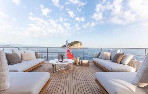 Charter yacht LEGEND exterior seating and sun pads