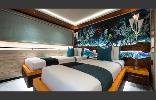 Overview of twin cabin with two single berths onboard charter yacht KING BENJI