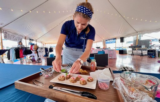 Superyacht chef creating plated entry for chef competition at the Newport Charter Yacht Show