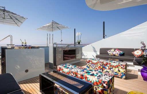 superyacht ocean paradise's deck seating area with television