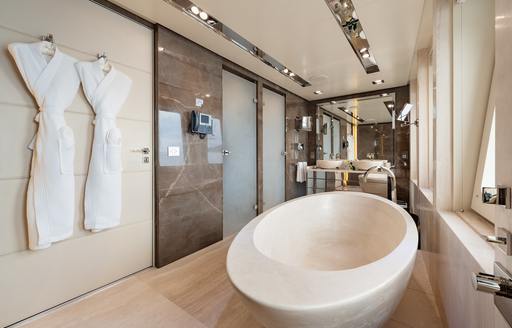Charter yacht LOON ensuite with robes hanging