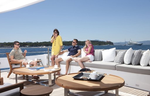 guests enjoy drinks in alfresco lounge on board expedition yacht SPIRIT 