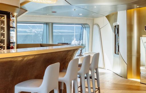 Charter yacht THIS IS IT wet bar with white stools