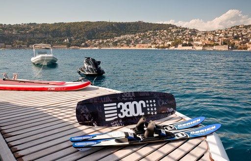 water toys lined up on swim platform of superyacht THUMPER 