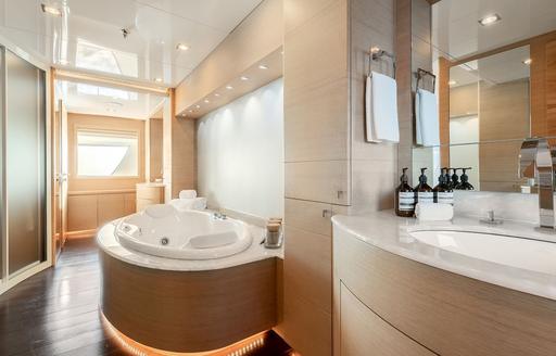 En suite with large bath and sink unit onboard charter yacht ZIA 