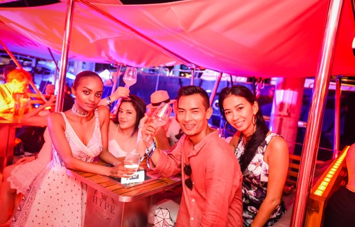 show attendees socialize at the Thailand Yacht Show 2016's closing party aboard luxury yacht HYPE