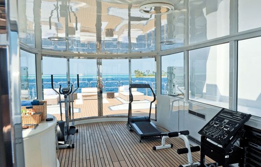 Glass encased gym on sundeck of superyacht magna grecia