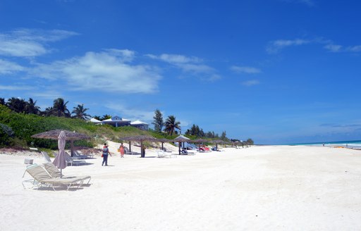People relaxing on Pink Sands Beach