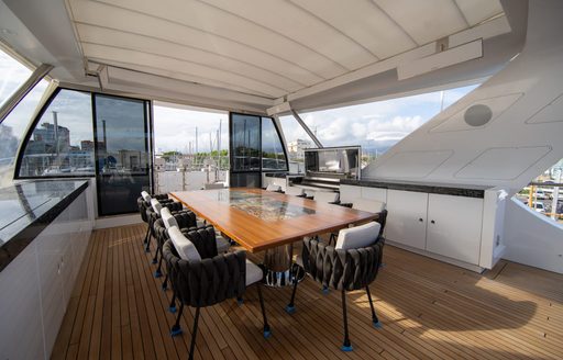 alfresco dining area on sundeck of luxury yacht happy me