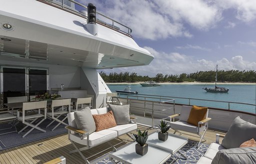 Outdoor dining area on deck of superyacht M3