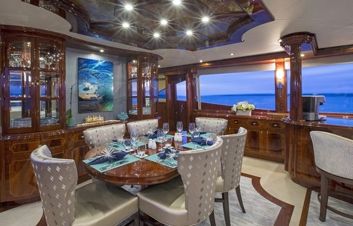 formal dining area in main salon on board superyacht ‘Gale Winds’ 