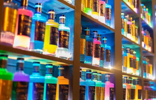 Wall of colored bottles at Cloud Rooftop Bar, Martinique
