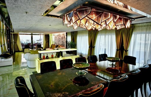 Interior dining area on the main deck onboard charter yacht SARASTAR