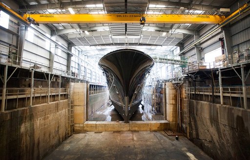 Superyacht AQUILA in the shed at the Pendennis shipyard in Falmouth, England