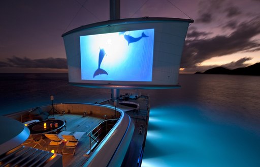 alfresco cinema setup on deck of luxury yacht Maltese Falcon at night