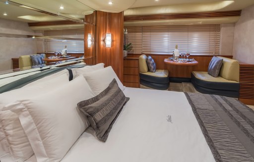 Owner's suite on luxury charter yacht ALMAZ, with private lounging area in background