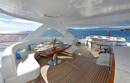 alfresco dining area under the shade of the radar arch on the sundeck of luxury yacht SOLIS 