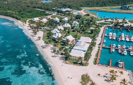 Drone shot capturing view over the marina and beach club 