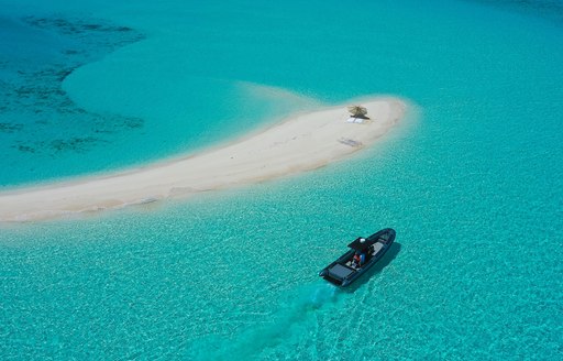 little tender and white sandbar in the maldives