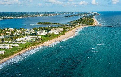 Aerial shot of Florida with blue sea and sandy beaches and condos on shore