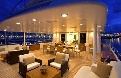 alfresco dining and seating area on the upper deck aft of motor yacht Deep Blue II