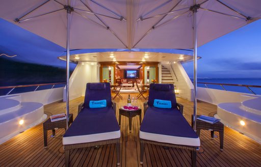 Charter yacht TELEOST sun loungers on deck