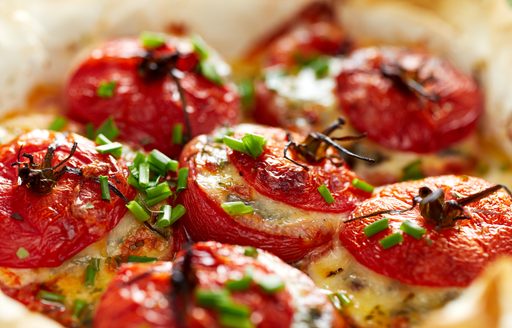 Stuffed tomatoes in a white dish