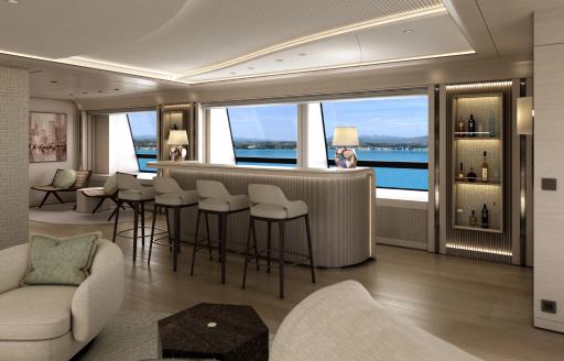 Wet bar and stools facing large window in the interiors of superyacht charter O'MADELEINE