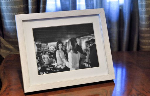 Black and photograph on stand of Jackie Kennedy on board iconic megayacht Christina O