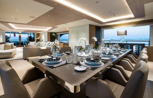 Superyacht charter ARTISAN interior dining table with large window