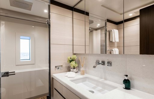 white sink and faucets in the head of luxury yacht jacozami 