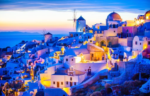 Beautiful Oia town in Santorini lit up at night, Greece