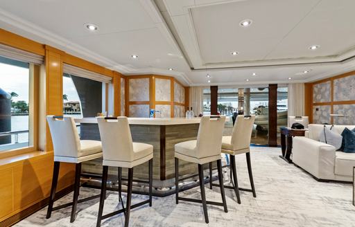 Charter yacht NOVERRA interior wet bar and four stools