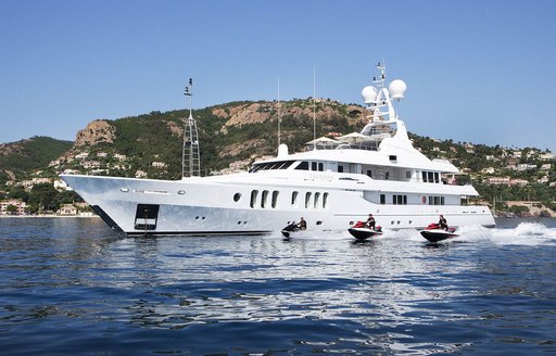 superyacht Talisman Maiton at anchor as charterers take out the jet skis 