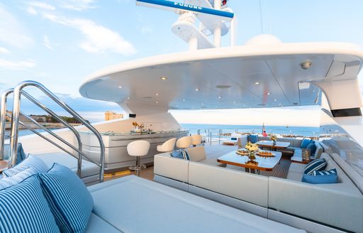 seating area and bar on the sundeck of a superyacht 