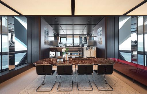 Charter yacht CONTIGO interior dining area with long table