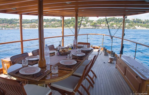 Al fresco dining on deck of luxury yacht Over the Rainbow