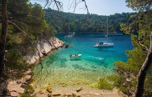 Yacht enjoying the beautiful crystal clear bay in Solta, Croatia 