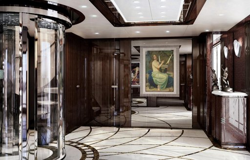 Benetti motor yacht SPECTRE main lobby, with glass lift, art deco lines on the floor and French oil painting on the wall