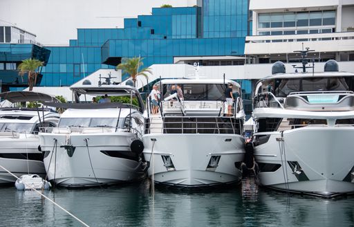 Motor yacht charters berthed in line at Cannes Yachting Festival