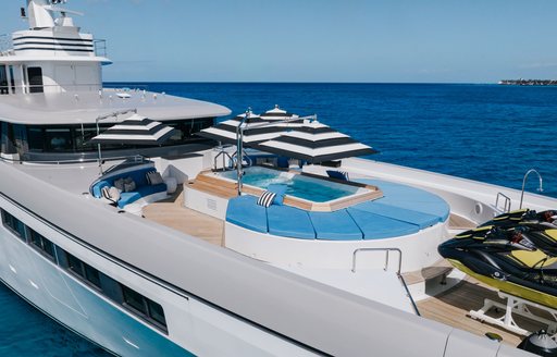 Sundeck onboard charter yacht ETERNITY with pool, sunpads and parasols