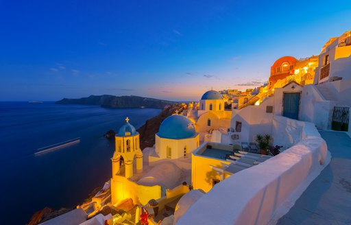 Blue and white buildings of Santorini lit up at nighttime