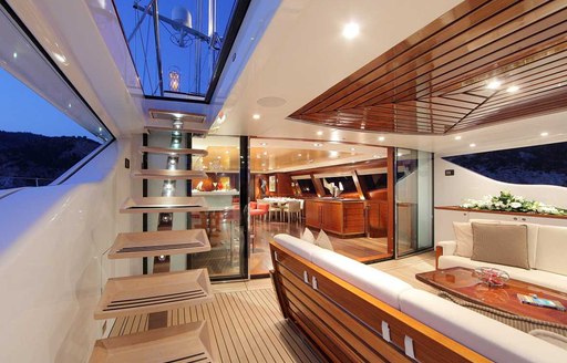 steps leading to sundeck on board luxury yacht prana with alfresco seating area adjacent