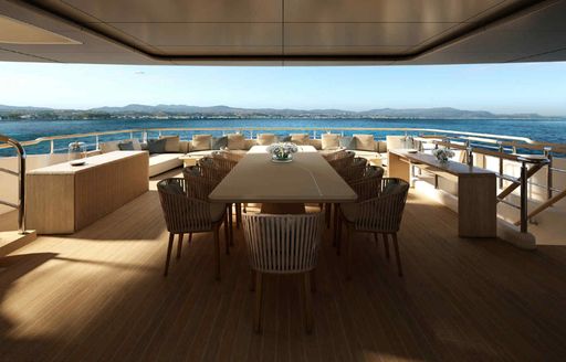 Alfresco dining rendering with large table and seating onboard superyacht charter O'MADELEINE