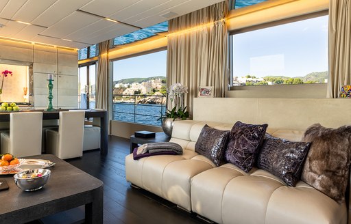 Sofa and chairs in main salon of motor yacht Cinquanta 50