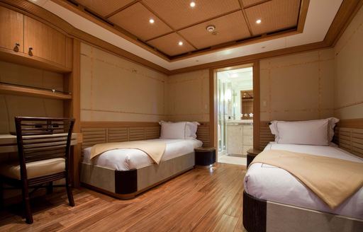 Twin single berths in a guest cabin onboard charter yacht HEMISPHERE