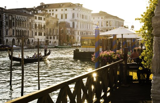 View across the grand canal from a balcony a gondola moves in the centre