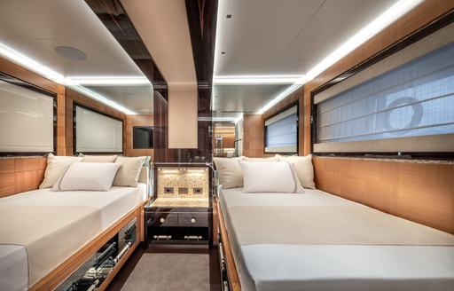 Overview of a twin guest cabin with two single berths onboard charter yacht SUNRISE