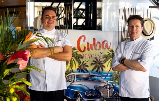 Posed photo of two charter yacht chefs from motor yacht TRIUMPH